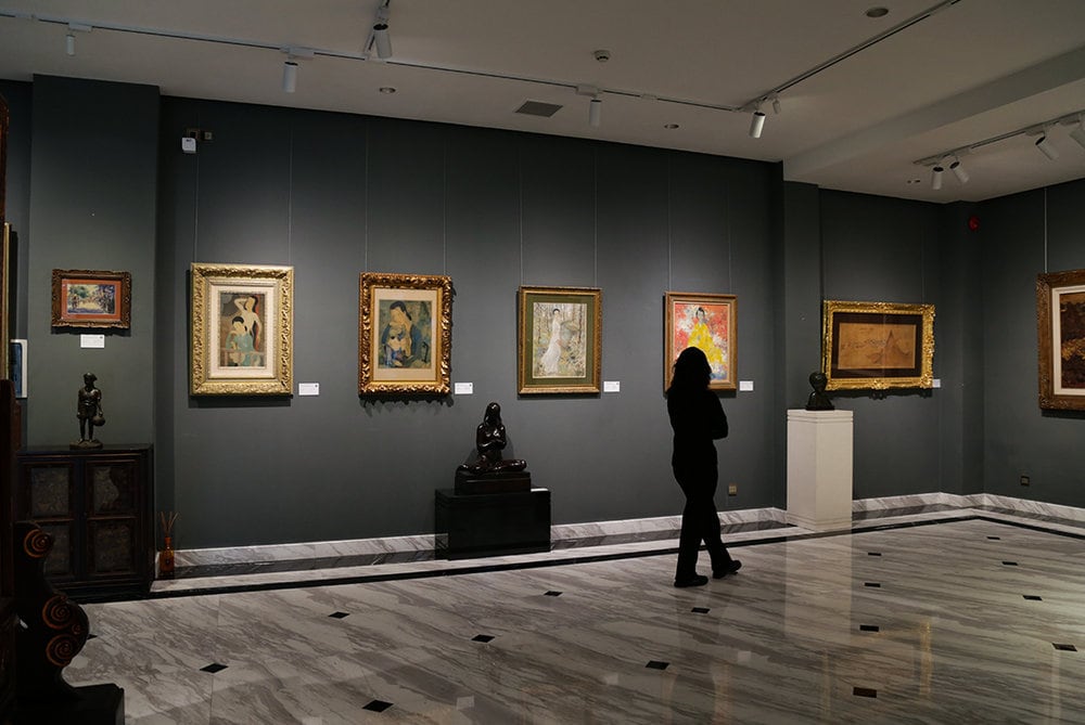 Visitors immerse themselves in the artwork, finding stories woven into every brushstroke 